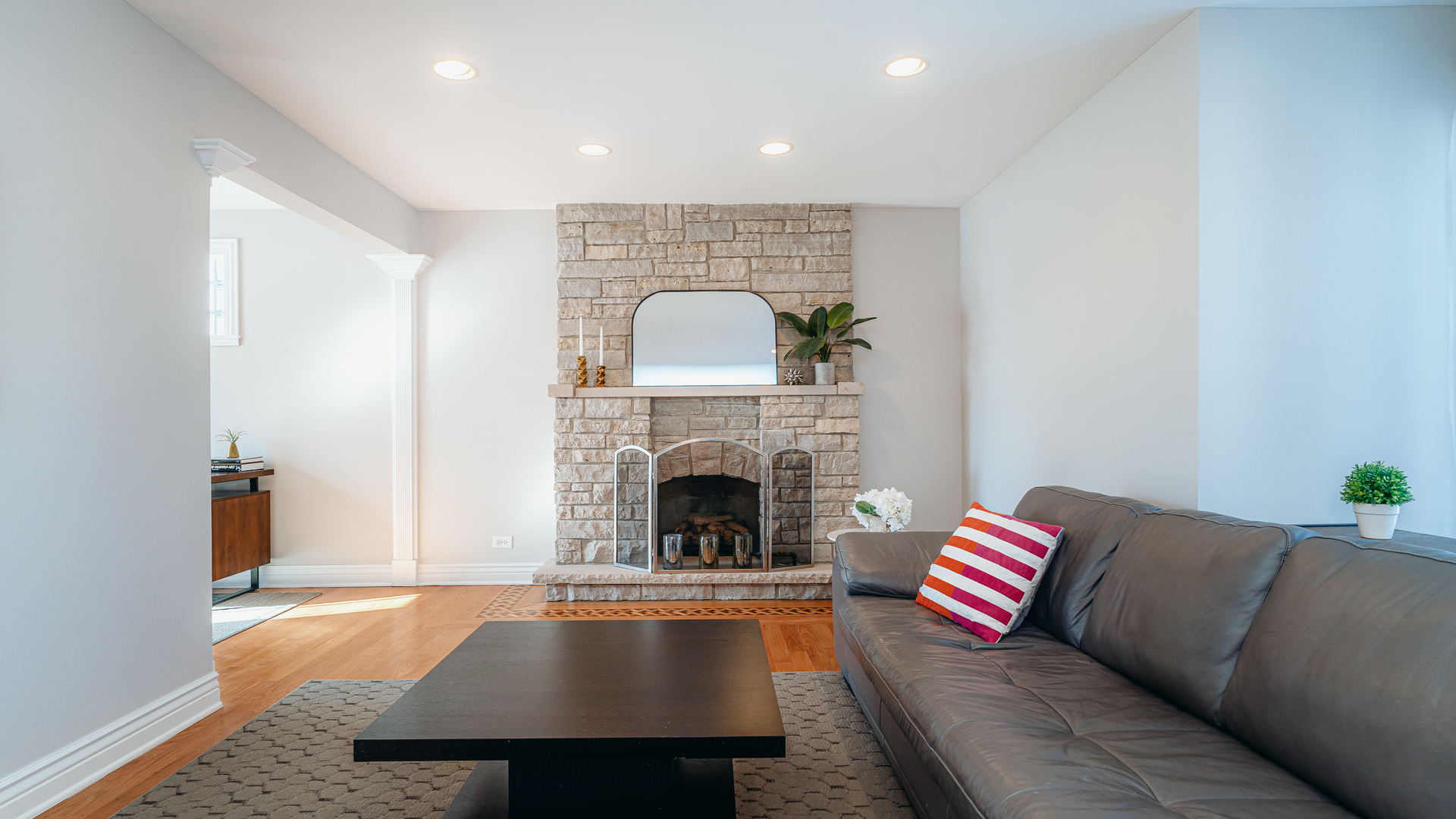 241 Devon Avenue Park Ridge, IL 60068 - Photo 5 of 46 a living room with furniture and a fireplace