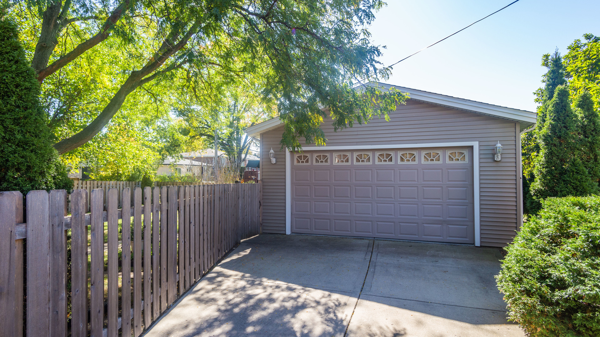 241 Devon Avenue Park Ridge, IL 60068 - Photo 42 of 46 a view of a wooden house with a large tree