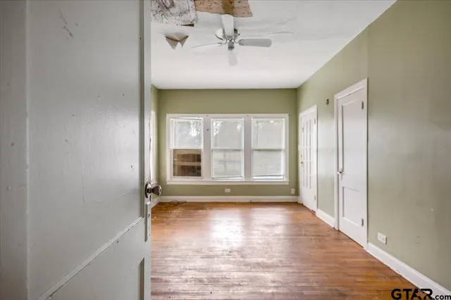 a view of an empty room with a window