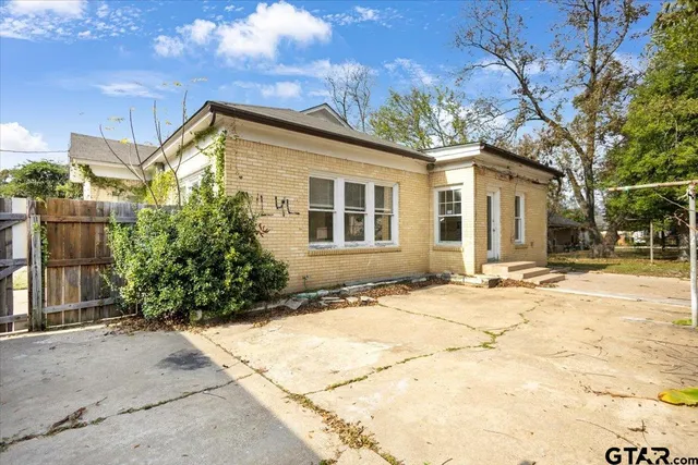 a view of a house with a snow in the yard
