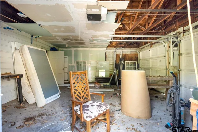 a view of an empty room with water heater room