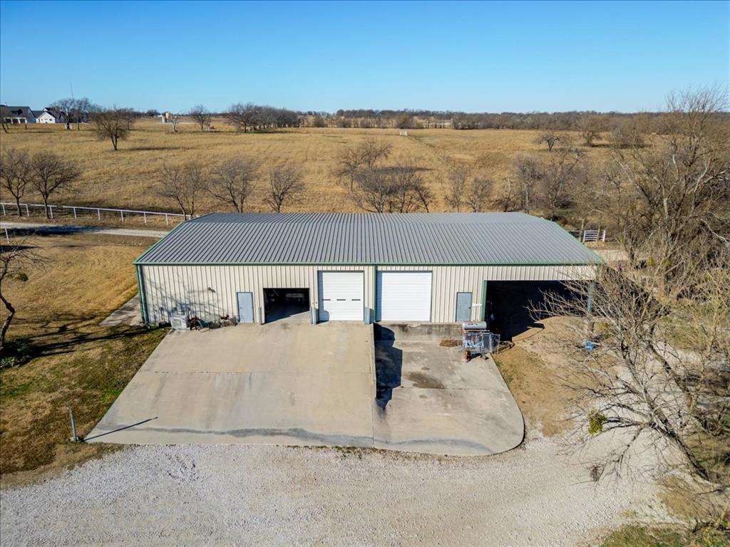 11918 Riek Road Krum, TX 76249 - Photo 32 of 40 a view of a house with a lake view