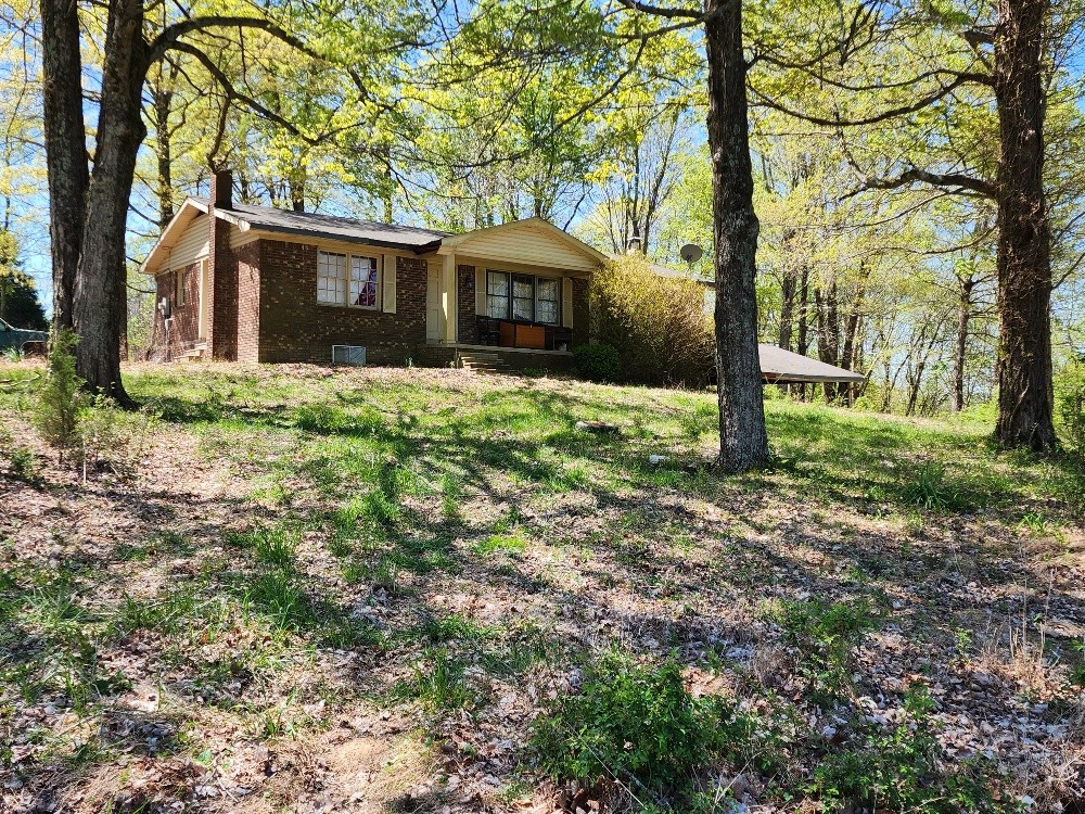 0 Howell Road Westmoreland, TN 37186 - Photo 3 of 7 a view of a house with backyard and a tree