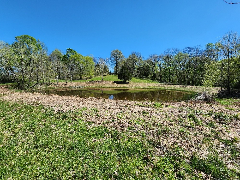0 Howell Road Westmoreland, TN 37186 - Photo 4 of 7 a view of a water pond with green space