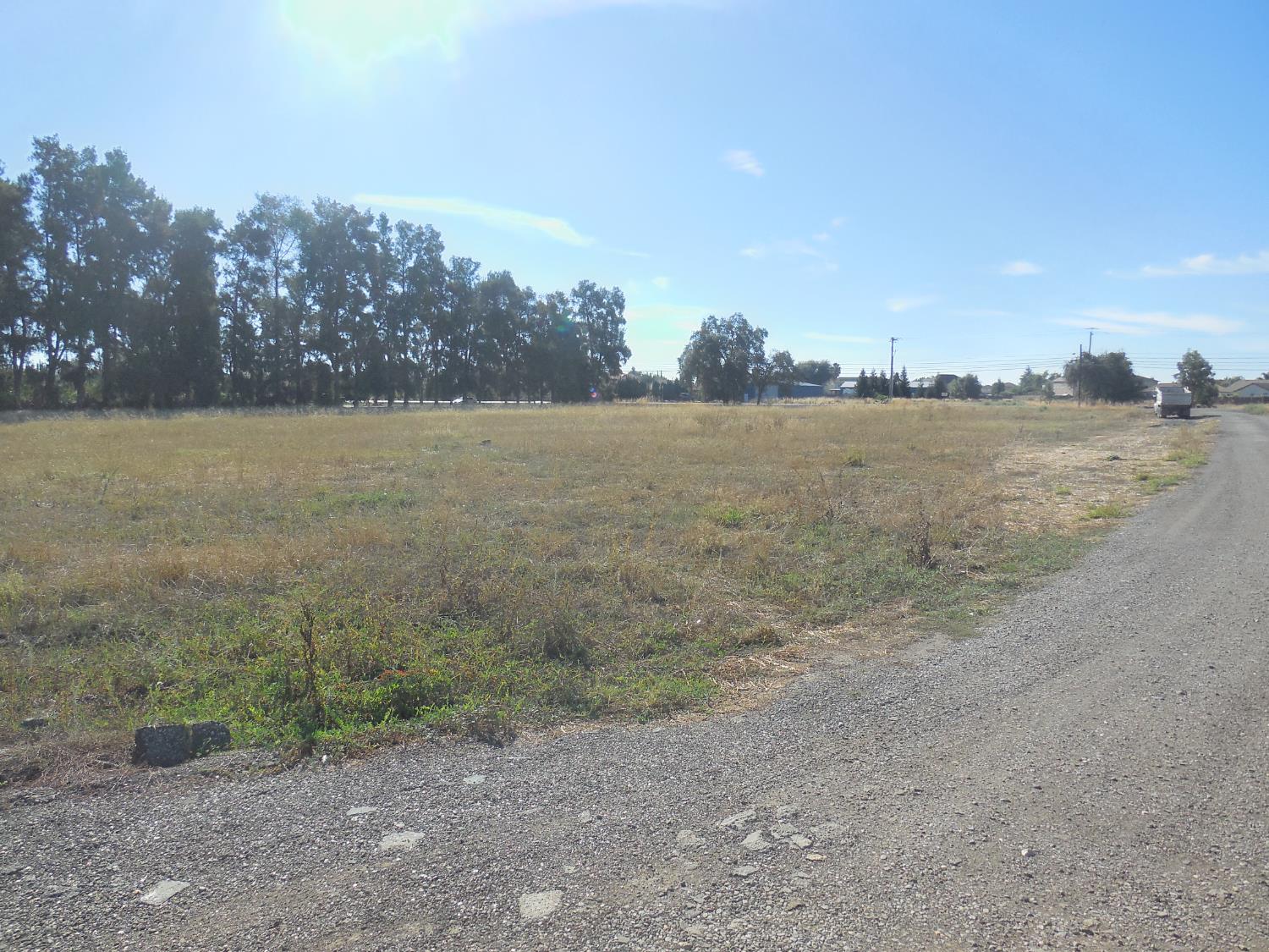 a view of a lake next to a mountain