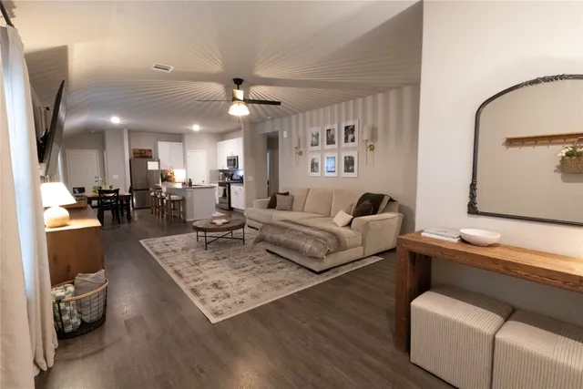 a living room with furniture and a table