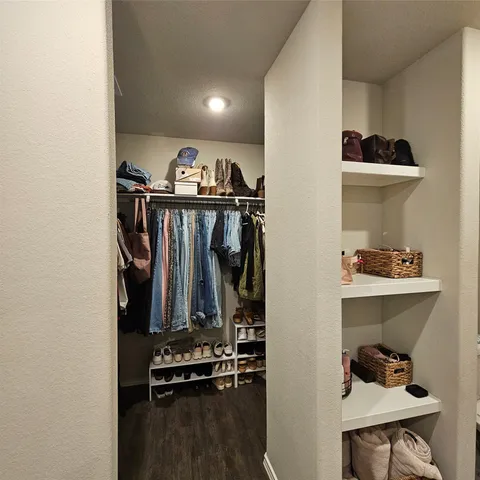 a view of a closet with storage