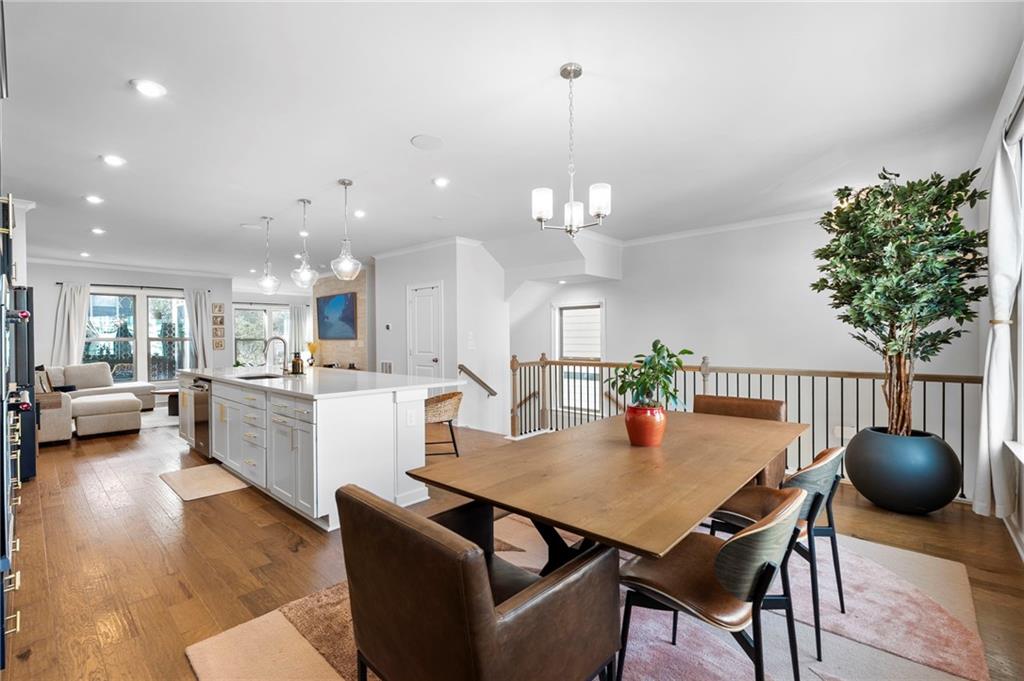 1320 Stanley Park Drive, Unit 141 Decatur, GA 30033 - Photo 11 of 71 a view of a dining room and livingroom with furniture wooden floor a chandelier
