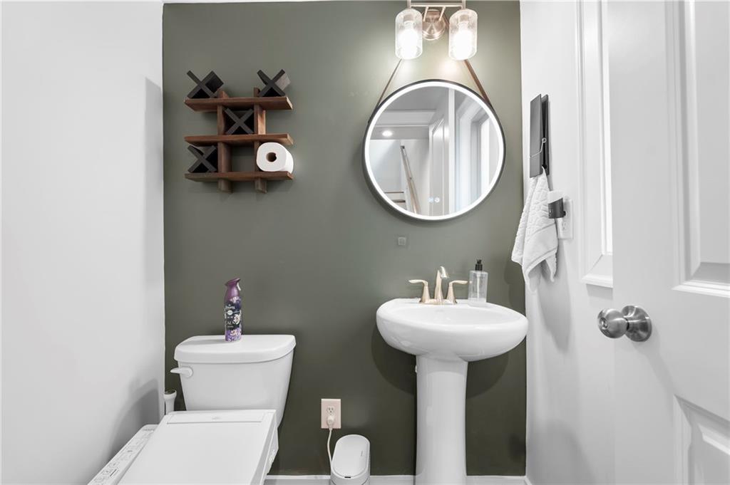 1320 Stanley Park Drive, Unit 141 Decatur, GA 30033 - Photo 20 of 71 a bathroom with a toilet sink and mirror