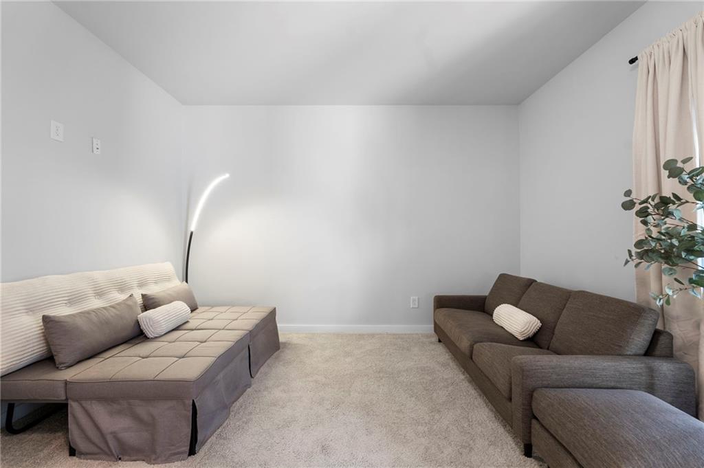 1320 Stanley Park Drive, Unit 141 Decatur, GA 30033 - Photo 40 of 71 a living room with furniture and a potted plant