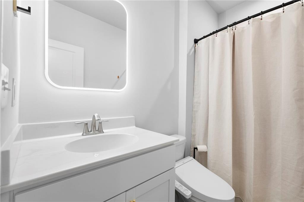 1320 Stanley Park Drive, Unit 141 Decatur, GA 30033 - Photo 43 of 71 a bathroom with a sink and a mirror