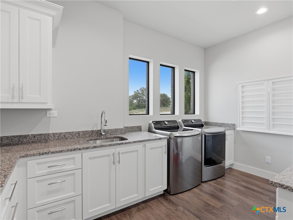 5913 Verden Ridge New Braunfels, TX 78132 - Photo 19 of 48 a kitchen with stainless steel appliances granite countertop a stove and a sink