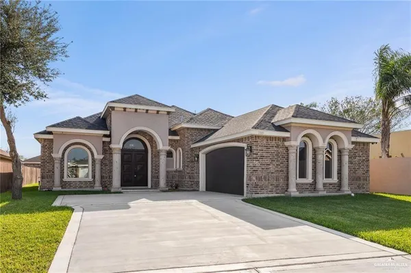 a large kitchen with a table and chairs