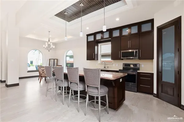 a bedroom with furniture and a large window