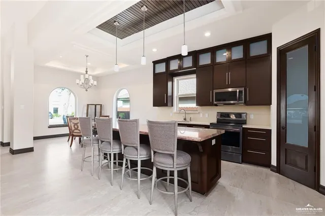 a bedroom with furniture and a large window