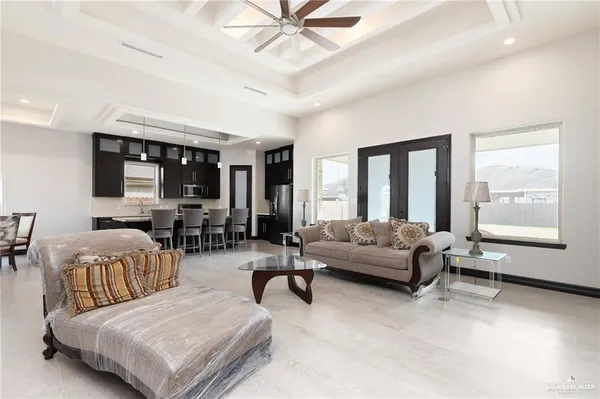 a bedroom with a bed a rug and a chair