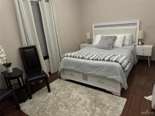 a bathroom with a sink a toilet a mirror and shower curtain