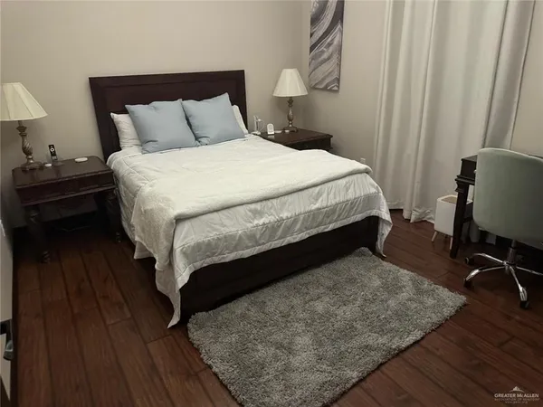 a bathroom with a sink toilet and mirror