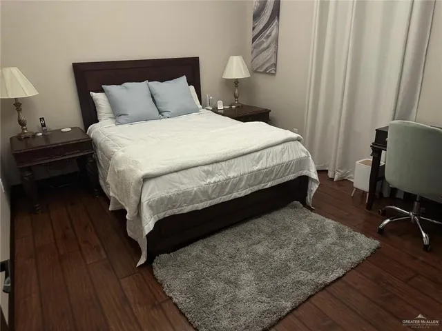 a bathroom with a sink toilet and mirror