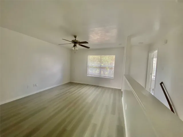 a view of an empty room and a window