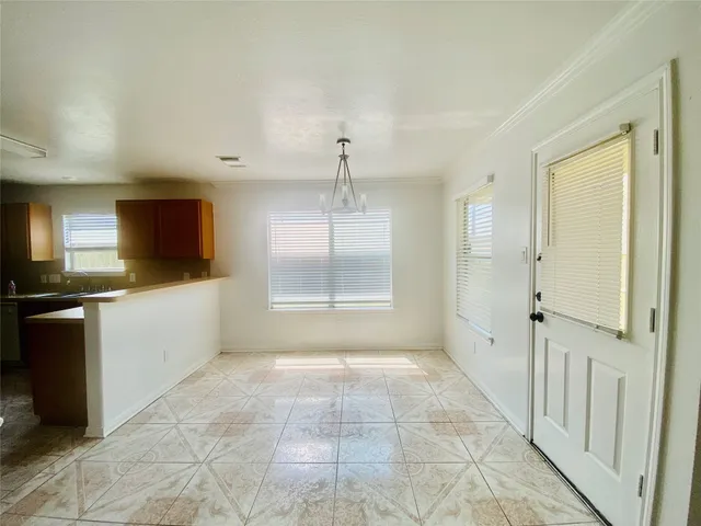 a view of a kitchen with a sink and a stove top oven