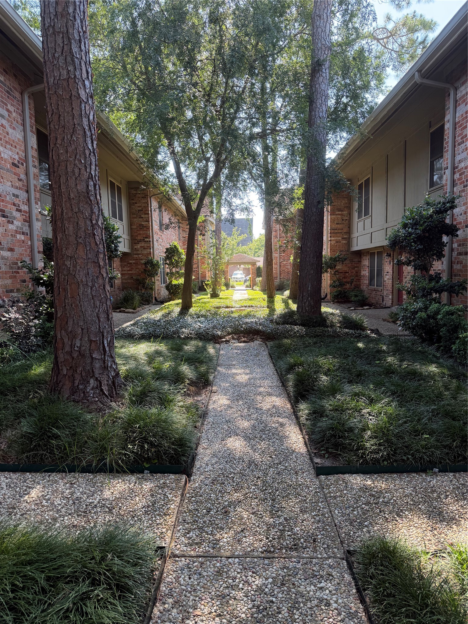 515 Tallowood Road, Unit 55 Houston, TX 77024 - Photo 5 of 18 a view of a house with a yard