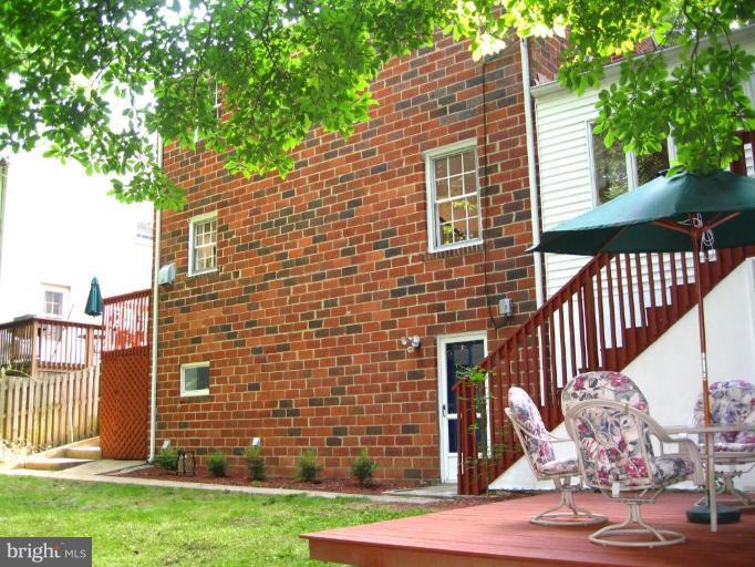 9919 Big Rock Road Silver Spring, MD 20901 - Photo 2 of 23 a brick house with a large windows
