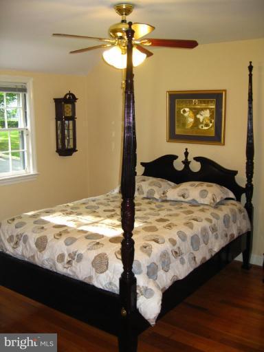 9919 Big Rock Road Silver Spring, MD 20901 - Photo 11 of 23 a bedroom with a bed and a window