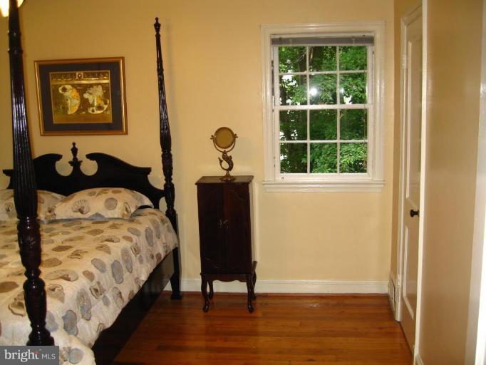 9919 Big Rock Road Silver Spring, MD 20901 - Photo 12 of 23 a bedroom with a bed and a window