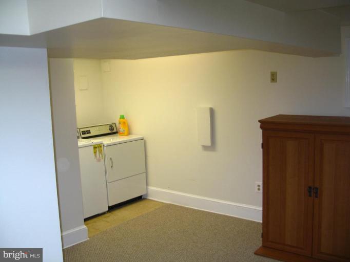 9919 Big Rock Road Silver Spring, MD 20901 - Photo 17 of 23 a utility room with dryer and washer