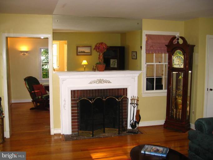 9919 Big Rock Road Silver Spring, MD 20901 - Photo 4 of 23 a living room with furniture and a fireplace