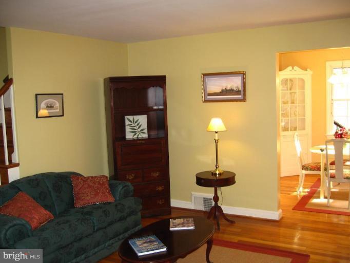9919 Big Rock Road Silver Spring, MD 20901 - Photo 6 of 23 a living room with furniture and a lamp