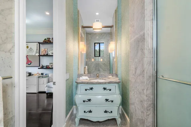 a bathroom with a sink vanity and a mirror