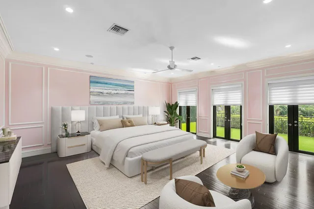 a large bedroom with a large bed and windows