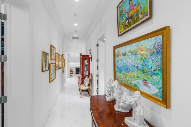 a view of a hallway with furniture and screen