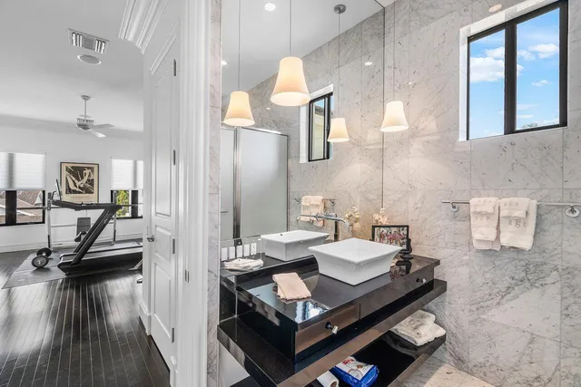 a bathroom with a sink mirror and vanity
