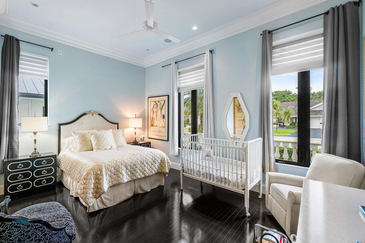 7172 Valencia Drive Boca Raton, FL 33433 - Photo 32 of 49 a bedroom with a bed and a large window