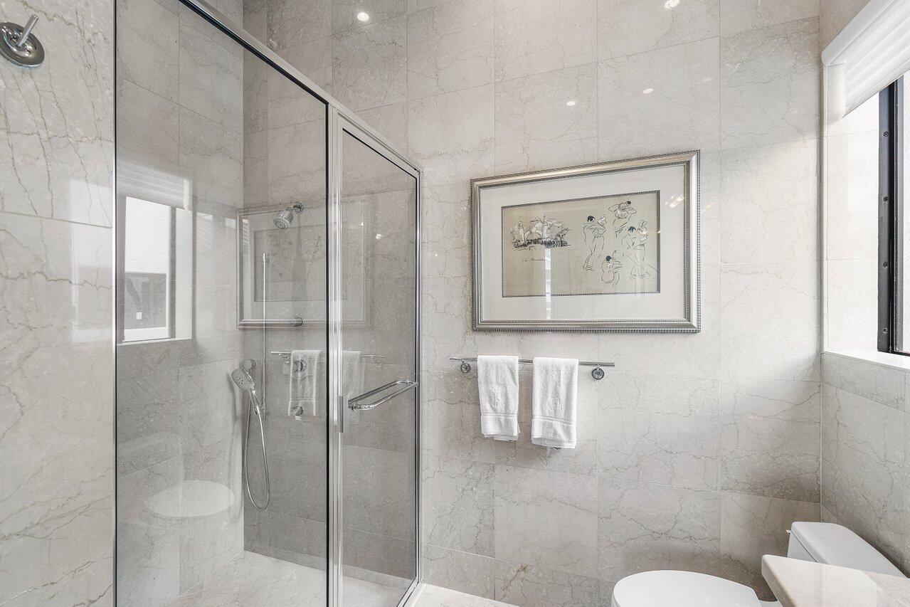 7172 Valencia Drive Boca Raton, FL 33433 - Photo 34 of 49 a bathroom with a shower and toilet