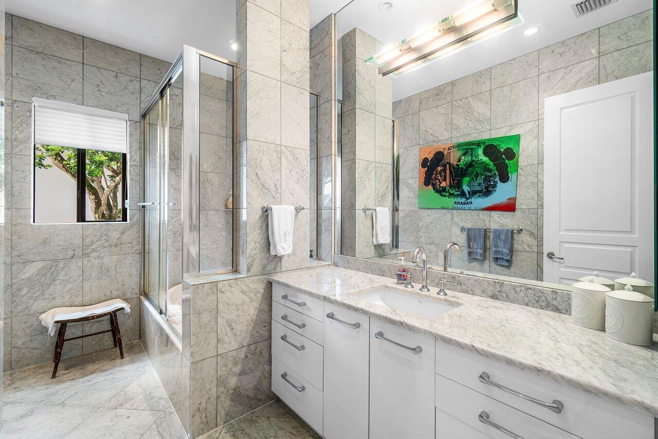 7172 Valencia Drive Boca Raton, FL 33433 - Photo 37 of 49 a bathroom with a double vanity sink and a mirror