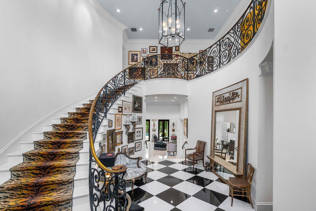 7172 Valencia Drive Boca Raton, FL 33433 - Photo 4 of 49 a view of entryway and hall with wooden floor