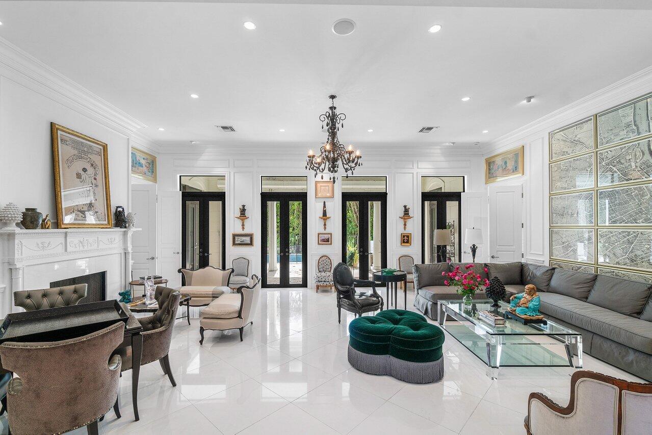 7172 Valencia Drive Boca Raton, FL 33433 - Photo 5 of 49 a living room with furniture potted plant and a fireplace