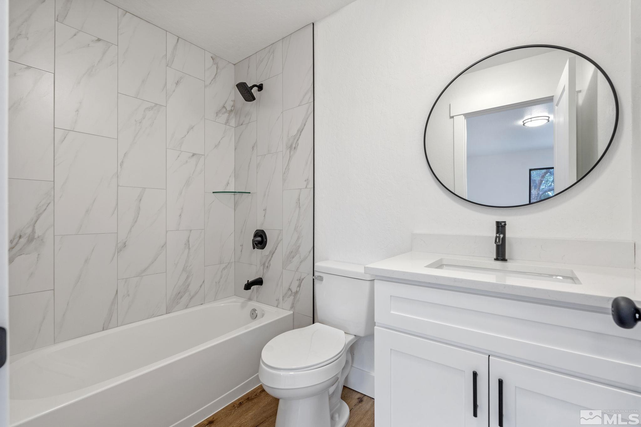 445 Anne Marie Court Reno, NV 89509 - Photo 24 of 27 a bathroom with a sink toilet and shower