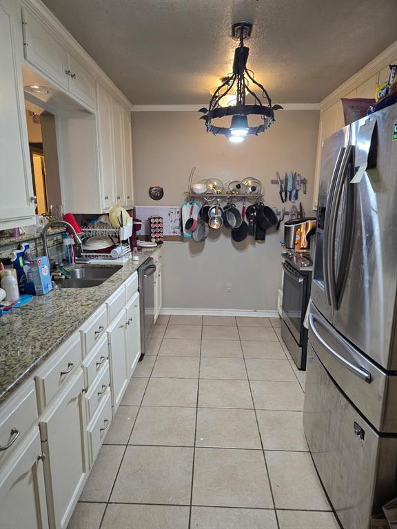 415 Ingred Street Waco, TX 76705 - Photo 4 of 8 a kitchen with a sink appliances and cabinets