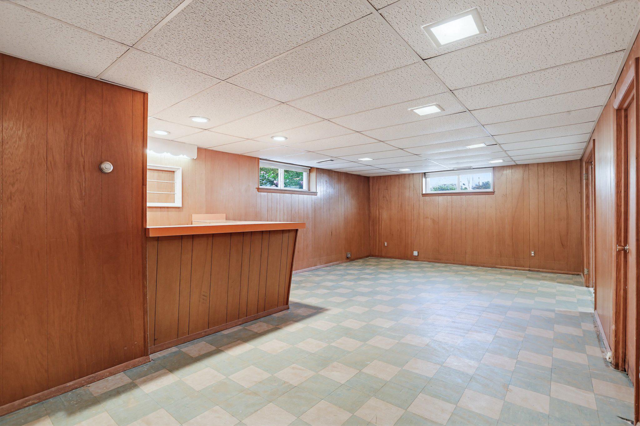 8145 Scotts Level Road Pikesville, MD 21208 - Photo 27 of 45 Spacious basement with warm wood tones.