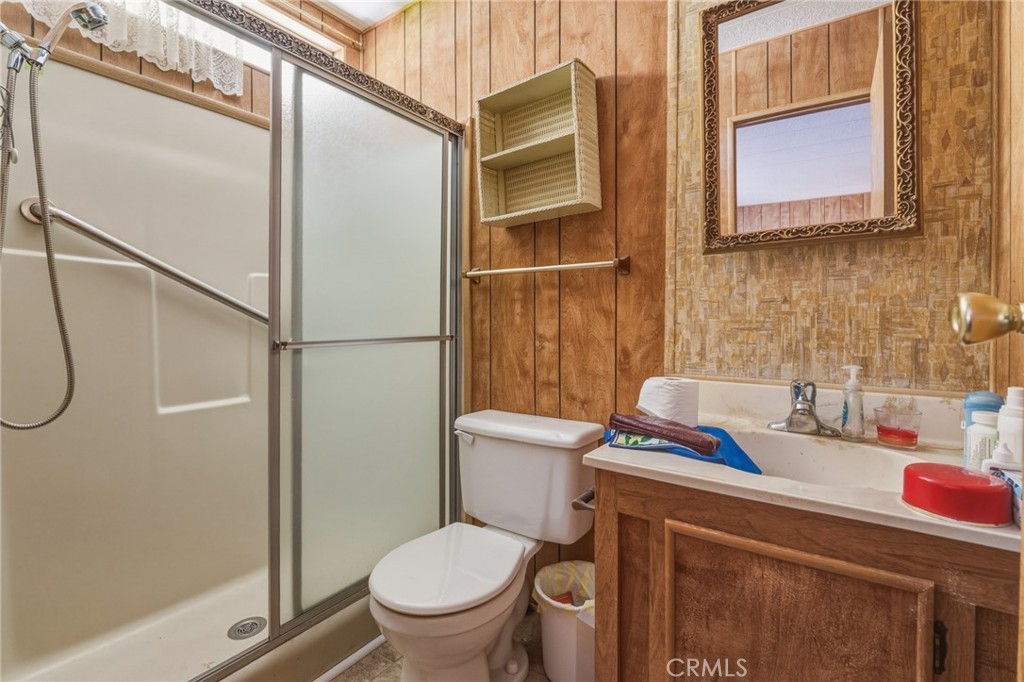 20683 Waalew Road, Unit B201 Apple Valley, CA 92307 - Photo 21 of 32 a bathroom with a granite countertop sink mirror vanity and toilet