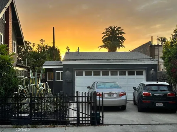 a front view of a house with parking