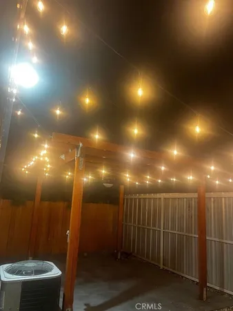 a view of a hallway and wooden floor