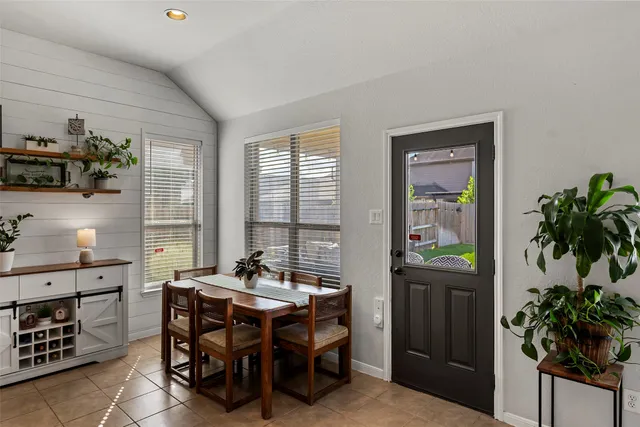 a view of a house with backyard porch and sitting area