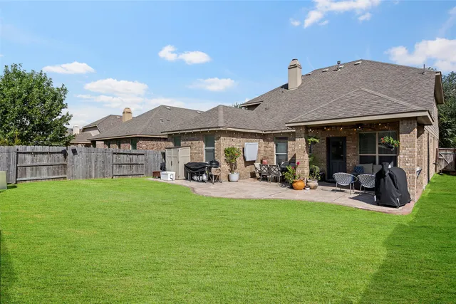 a kitchen with stainless steel appliances granite countertop a refrigerator stove and sink