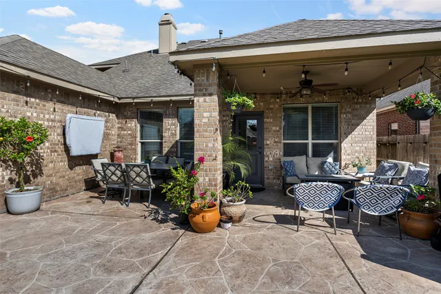 a kitchen with stainless steel appliances granite countertop a stove refrigerator and sink